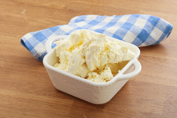 Italian soft mascarpone cheese in the bowl