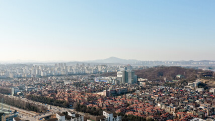 shoot a town with a drone showing villas and building forests