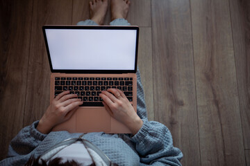 woman freelancer working at home sitting on the floor