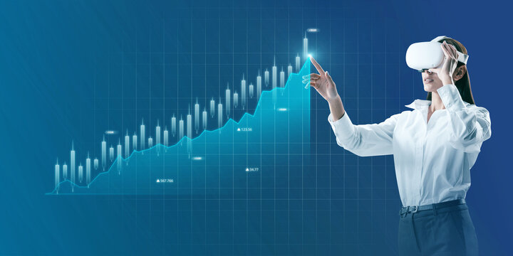 Attractive young businesswoman with vr glasses and abstract glowing business chart on blue background. Trade, augmented reality, ai, finance and economy concept.