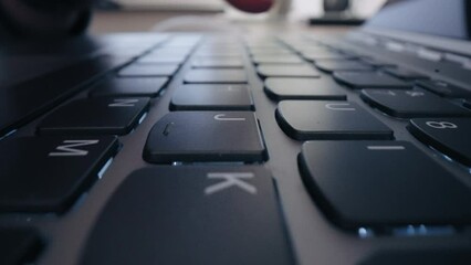 Close-up Moving Macro Shot: close up hands typing on keyboard programmer coding software gamer using keyboard - Powered by Adobe