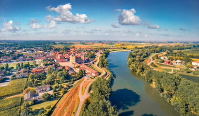 Marvelous summer view from flying drone of Mesola Castle. Sunny morning cityscape of Mesola town, Italy, Europe. Traveling concept background.