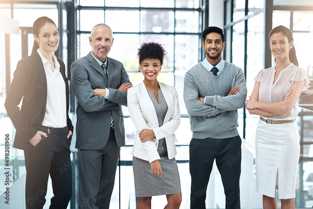 Poster we strive to be the best team in the business. portrait of a happy group of colleagues standing toge