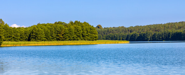 Wooded shore of Jezioro Gwiazdy lake in Bukowo Borowy Mlyn Village near Bytow of Pomerania in Kashubian region of northern Poland © Art Media Factory