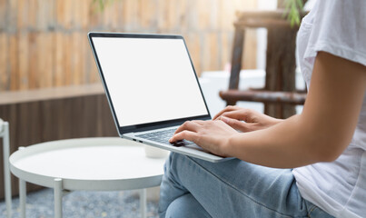 Young asian woman in casual clothing working on laptop computer while sitting in outdoor cafe, woman relaxing and work part time job, Concept working with new normal