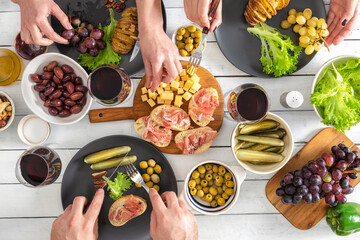Top view of group of people having dinner together. Dinner with friends concept