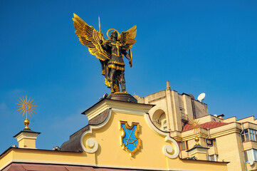 Golden statue of Archangel Michael on the top of historical Lach Gates at Independence Square,...