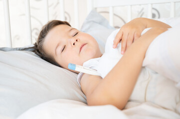 Obraz na płótnie Canvas Sick baby boy sleeping in bed