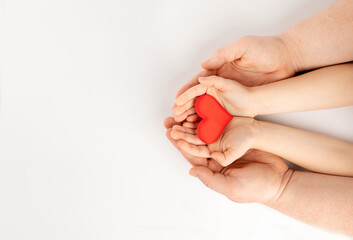 hands holding a red heart