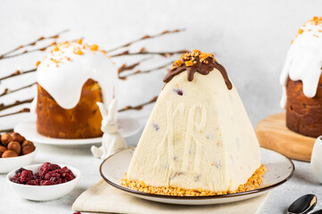 Traditional cottage cheese Easter paskha and eggs on white table. Russian paskha. Easter dessert....