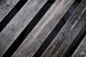 Close-up photo of vintage wooden cafe table. Old wood planks in diagonal view.