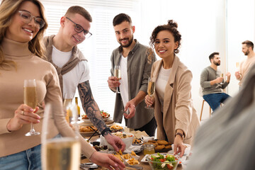 Group of people enjoying brunch buffet together indoors