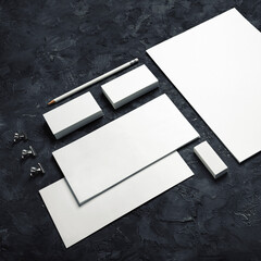 Blank stationery set on black plaster background. ID template. Mockup for branding identity for designers.