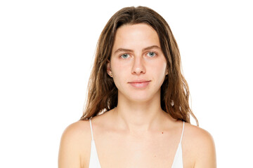 Portrait of a young woman without makeup on a white background