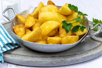 close up of baked potato in dish