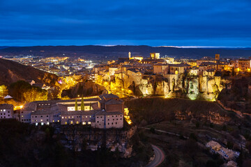 Fototapeta na wymiar Illuminated picturesque city of Cuenca at dusk. Travel Spain