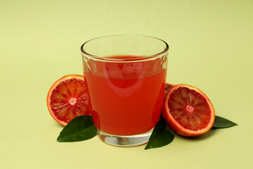 Concept of fresh drink with red orange juice, close up