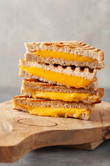 grilled cheese sandwich on gray concrete background