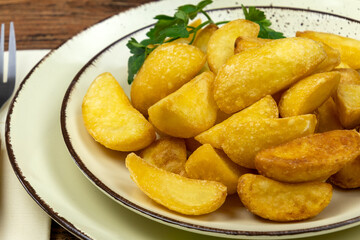 close up of baked potato on a plate