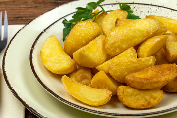 close up of baked potato on a plate