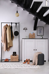 Modern hallway interior with stylish furniture and key holder