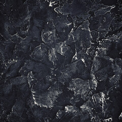 Black plaster texture. Black stucco background. Copy space for text. Flat lay.