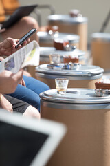 close up of people at a coffee shop table 