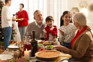 Happy family enjoying festive dinner at home. Christmas celebration