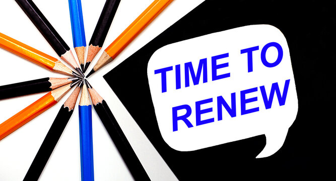On a light background, multi-colored pencils and on a black background a white card with the text TIME TO RENEW