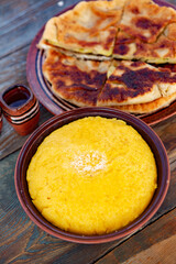 polenta is a dish made from corn flour, served with a book and cheese. Traditional food in Romania and the Republic of Moldova