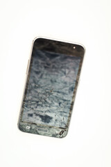 Broken cell phone on white background. Touchscreen smartphone with cracked lcd.