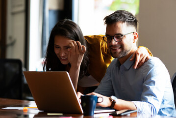 Colleagues in office. Businesswoman and businessman discussing work in office..