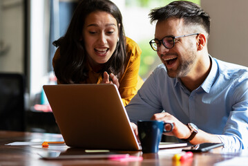 Colleagues in office. Businesswoman and businessman discussing work in office..