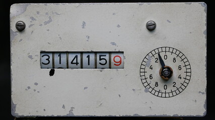 The numbers on the old meter show the number 3.14159. This is the constant of pi in mathematics