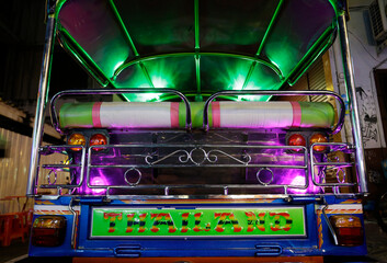 A colorful Tuk-tuk decorated with green and purple neon lights is seen parked in Khaosan Road,...