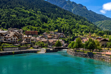 Fototapeta na wymiar Alpine lake and small town in Piedmont, Italy.