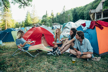 Friends having fun on the campsite at a music festival
