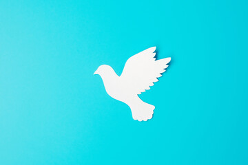 International Day of Peace. white paper Dove bird on blue background. Freedom, Hope and World Peace day 21 September concepts.