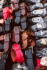 Lagos Island, Lagos NIGERIA - April 8, 2022: Various type of leather belt displayed for slae in roadside marketplace. selective focus - obrazy, fototapety, plakaty