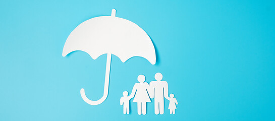 Umbrella cover family paper on blue background. International day of families, Healthcare, wellness and Insurance concept