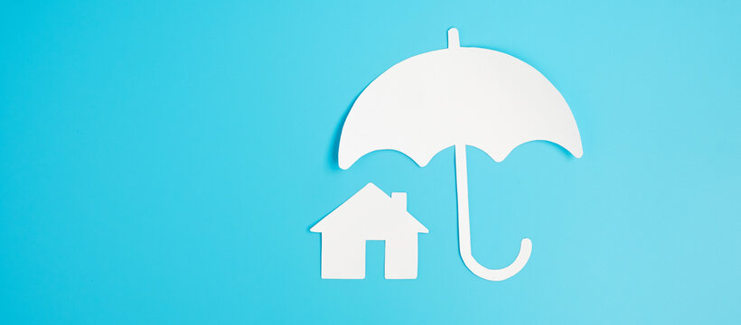 Umbrella Cover Home Paper On Blue Background. Warranty, Maintenance, Real Estate And Insurance Concept