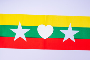 Support for Myanmar people, peace dove with flag of Myanmar. Freedom, stop war, dictatorship and democracy concepts