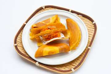 Thai crispy pancakes on white background.