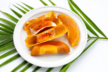 Thai crispy pancakes on white background.