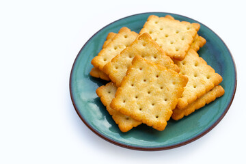 Dry cracker cookies on white background.