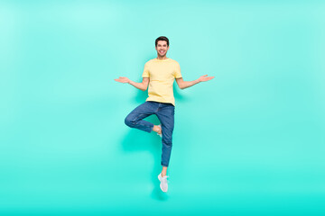 Fototapeta na wymiar Full length portrait of satisfied glad young person hands palms isolated on teal color background