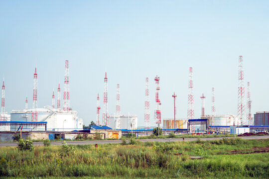 Oil depot on the background of the sky with a lot of lightning rods