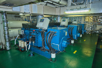 Diesel generators, auxiliary engines in engine room of cargo vessel