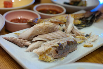 grilled mackerel with flesh cut to make it easier to eat