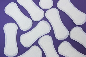 women's sanitary pads on a purple background very peri